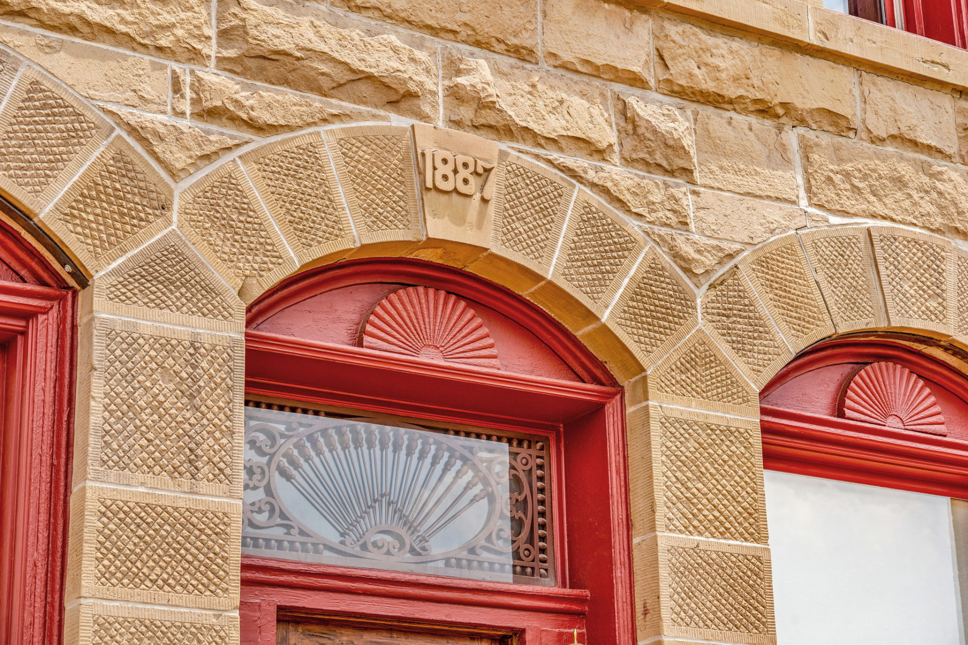 The 1887 stone facade of the Wolff Building, home of The Wildflower Hotel